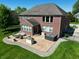 Aerial view of backyard patio with hot tub, outdoor kitchen, and comfortable seating area at 2219 Stone Manor Ct, Avon, IN 46123