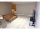 Finished basement space with plush carpeting, neutral paint, media center, and futon at 2219 Stone Manor Ct, Avon, IN 46123