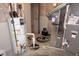 HVAC system, including a water heater and furnace, in an unfinished basement at 2219 Stone Manor Ct, Avon, IN 46123