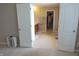 En-suite bathroom with double vanity, tile flooring, and walk-in closet access at 2219 Stone Manor Ct, Avon, IN 46123