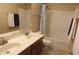 Bathroom featuring double sinks with a dark wood cabinet, a shower with curtain, and neutral walls at 2219 Stone Manor Ct, Avon, IN 46123