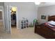 Bedroom featuring a wood bed frame, neutral walls, and a walk-in closet with plenty of storage at 2219 Stone Manor Ct, Avon, IN 46123
