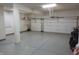 Epoxy floor in this garage provides great lighting and has an access door at 2219 Stone Manor Ct, Avon, IN 46123