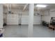 Spacious three-car garage with epoxy flooring and ample storage space for vehicles and equipment at 2219 Stone Manor Ct, Avon, IN 46123
