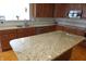 Kitchen with granite counters, stainless steel appliances, and a large island, perfect for entertaining at 2219 Stone Manor Ct, Avon, IN 46123