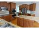 Gourmet kitchen with stainless steel appliances, a granite island, and ample cabinet space at 2219 Stone Manor Ct, Avon, IN 46123