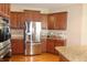 Modern kitchen features stainless steel appliances, granite countertops, and custom cabinetry at 2219 Stone Manor Ct, Avon, IN 46123