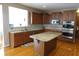 Spacious kitchen with wooden cabinets, granite countertops, stainless steel appliances, and a central island at 2219 Stone Manor Ct, Avon, IN 46123
