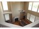 Elevated view of the living room with fireplace and large windows offering natural light at 2219 Stone Manor Ct, Avon, IN 46123