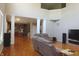 Open living space with hardwood floors, fireplace, and seamless connection to the kitchen at 2219 Stone Manor Ct, Avon, IN 46123