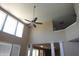 Lofted view of the living room showcasing a ceiling fan and abundant natural light at 2219 Stone Manor Ct, Avon, IN 46123