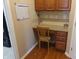 Dedicated office nook featuring built-in desk and cabinet storage in the kitchen at 2219 Stone Manor Ct, Avon, IN 46123