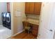 Dedicated office nook featuring built-in desk and cabinet storage near the laundry at 2219 Stone Manor Ct, Avon, IN 46123
