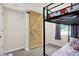Cozy bedroom featuring a bunk bed and a wooden barn door, offering comfort and style at 2303 Midway St, Columbus, IN 47201