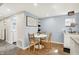 A cozy dining area features a modern table and chairs, complemented by stylish decor and ample natural light at 2303 Midway St, Columbus, IN 47201