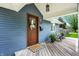 Cozy front porch with seating and stylish decor creates an inviting entryway to the home at 2303 Midway St, Columbus, IN 47201