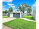 Garage with white door and concrete driveway at 2303 Midway St, Columbus, IN 47201