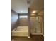 Bathtub with glass shower doors at 2680 Newington Ln, Carmel, IN 46074