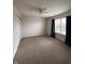Spacious bedroom with neutral carpet, ceiling fan, and natural light from the window at 2680 Newington Ln, Carmel, IN 46074