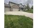 Charming two-story home featuring a welcoming front porch and three-car garage at 2680 Newington Ln, Carmel, IN 46074