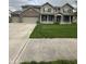 Charming two-story home featuring a welcoming front porch and three-car garage at 2680 Newington Ln, Carmel, IN 46074