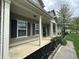 Inviting front porch with classic columns and well-maintained landscaping at 2680 Newington Ln, Carmel, IN 46074