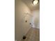 Bright laundry room with vinyl flooring and shelving for storage at 2680 Newington Ln, Carmel, IN 46074