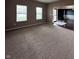 Comfortable living room with neutral carpet and ample natural light at 2680 Newington Ln, Carmel, IN 46074