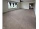 Bright carpeted living room featuring great natural light and an open doorway at 2680 Newington Ln, Carmel, IN 46074