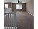 Spacious carpeted living room with a ceiling fan and great natural light at 2680 Newington Ln, Carmel, IN 46074