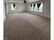 Large carpeted living room featuring multiple windows for great natural light at 2680 Newington Ln, Carmel, IN 46074