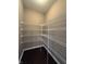 Walk-in pantry with wire shelving and dark wood flooring at 2680 Newington Ln, Carmel, IN 46074