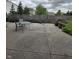 A view of the concrete patio area with a table and chairs, perfect for outdoor dining and relaxation at 2680 Newington Ln, Carmel, IN 46074