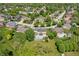 Aerial view featuring a sparkling swimming pool and a beautiful home with a well-manicured lawn at 28 Hudson Bay Ln, Greenwood, IN 46142
