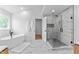 Bright bathroom features white freestanding tub, marble floors, and glass shower at 28 Hudson Bay Ln, Greenwood, IN 46142