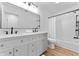 Newly renovated bathroom with white subway tile shower, and a unique vanity with modern fixtures at 28 Hudson Bay Ln, Greenwood, IN 46142