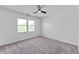 Bright bedroom with plush carpet, natural light, and ceiling fan at 28 Hudson Bay Ln, Greenwood, IN 46142