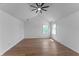 Bright and airy bedroom with hard wood floors, a fan, and natural light from the windows at 28 Hudson Bay Ln, Greenwood, IN 46142