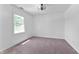 A clean, bright bedroom with natural light, plush carpet and modern ceiling fan at 28 Hudson Bay Ln, Greenwood, IN 46142