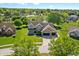 Beautiful home boasts professional landscaping, a two-car garage, and a peaceful pond view at 28 Hudson Bay Ln, Greenwood, IN 46142