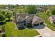 Beautiful home boasts professional landscaping, a two-car garage, and a manicured lawn at 28 Hudson Bay Ln, Greenwood, IN 46142
