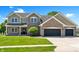 Charming two-story home featuring manicured front lawn and a two-car garage at 28 Hudson Bay Ln, Greenwood, IN 46142