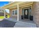 Inviting brick home featuring an elegant front door with decorative glass and sidelights at 28 Hudson Bay Ln, Greenwood, IN 46142