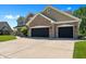 Spacious two-car garage and a beautiful home featuring well-manicured front lawn at 28 Hudson Bay Ln, Greenwood, IN 46142