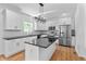Modern kitchen featuring white cabinets, stainless appliances, and black countertops at 28 Hudson Bay Ln, Greenwood, IN 46142