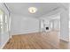 Bright living room with hardwood floors and view of fireplace and windows in the home at 28 Hudson Bay Ln, Greenwood, IN 46142