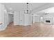 Bright and airy living space with hardwood floors, chandelier, and an open floor plan at 28 Hudson Bay Ln, Greenwood, IN 46142