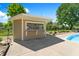Poolside bar and pool house featuring a windowed opening for seamless beverage service at 28 Hudson Bay Ln, Greenwood, IN 46142