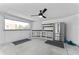 Pool house interior with stainless steel refrigerator and shelving space for pool supplies at 28 Hudson Bay Ln, Greenwood, IN 46142