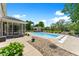 Backyard pool area featuring a gunite pool, poolhouse, and screened in porch area at 28 Hudson Bay Ln, Greenwood, IN 46142